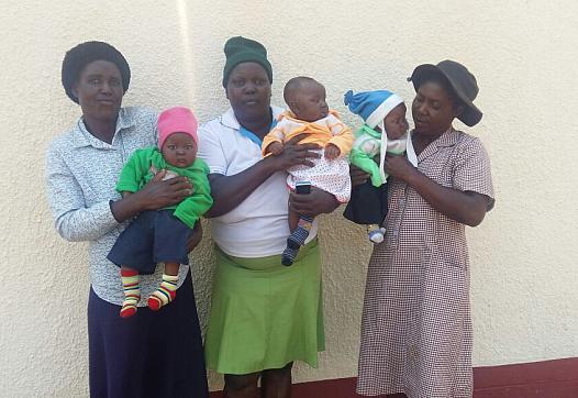 Voiness Nyatsuro in the middle holding her triplets 
