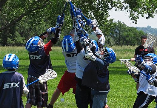Dakota children playing lacrosse