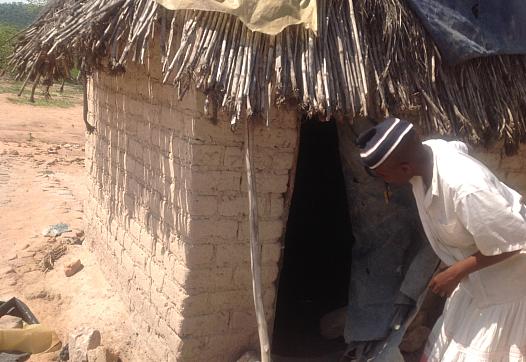 traditional birth attendant entering a shelter to check on a pregnant woman