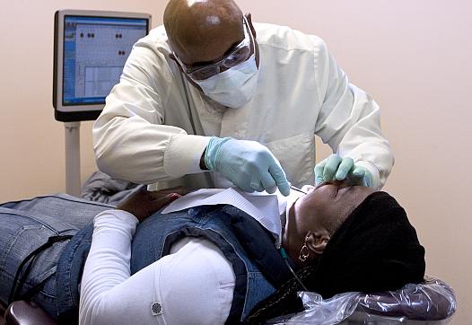 D.C. dentist Albert Cheek prides himself on his skill with extractions.