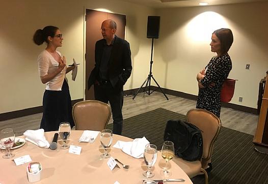 Alex Kotlowitz, center, speaks with reporters at the 2019 National Fellowship this week.