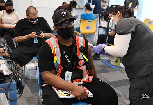 Employees are vaccinated at an Amazon fulfillment center in March in North Las Vegas, Nevada. 