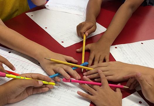 Kids at Schaefer Elementary write their poems.
