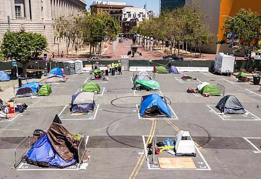 Rectangles painted on the ground to encourage homeless people socially distance at a city-sanctioned homeless encampment 