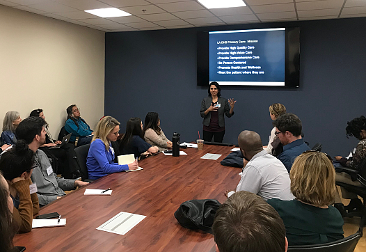 Dr. Jagruti Shukla, director of primary care at LAC+USC, talks to journalists about addressing patients' social needs.