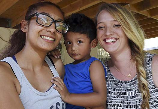 Former Fresno High student Viririana Covarrubias, left, with her son Sebastian and reporter Mackenzie Mays. Covarrubias became p