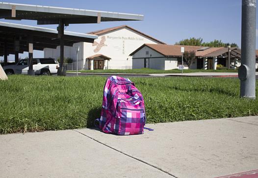 Backpack on sidewalk