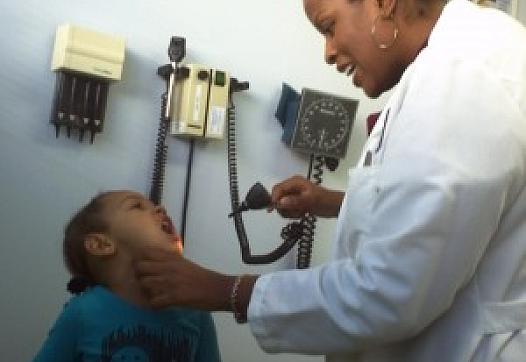 Pediatrician Porshia Mack examines 3-year-old Sania Bettancourt at Richmond LifeLong community health clinic.