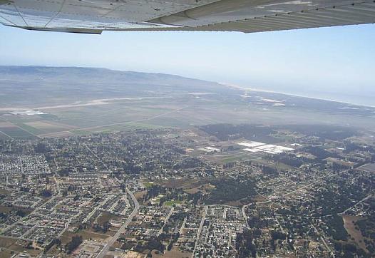 Aerial views of the Nipomo Mesa show a plume of dust that sweeps through the community on windy days.