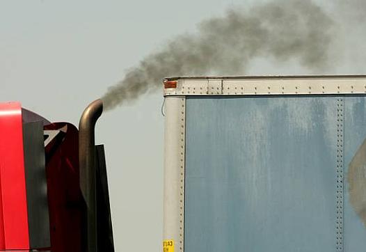  Diesel exhaust is released into the air from a big rig as it accelerates near the the intersection of Van Buren Blvd. and Etiwanda Ave. in the Mira Loma area of Jurupa Valley.