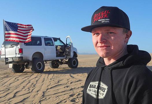 Austin Gladden, 19, poses for a picture at the Oceano Dunes State Vehicular Recration Area near Pismo Beach. 