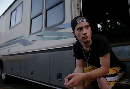  Caleb La Chance, 18, sits on the steps of the RV he lives in for a portrait on Tuesd
