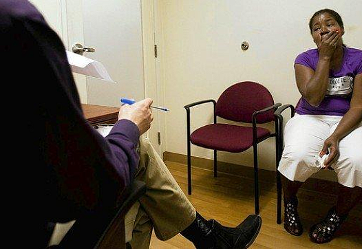 A patient talks about her depression to therapist Neil Martin at T.H.E. Clinic in South Los Angeles. “It’s so linked, physical and mental health,” Martin said. (Gina Ferazzi, Los Angeles Times)