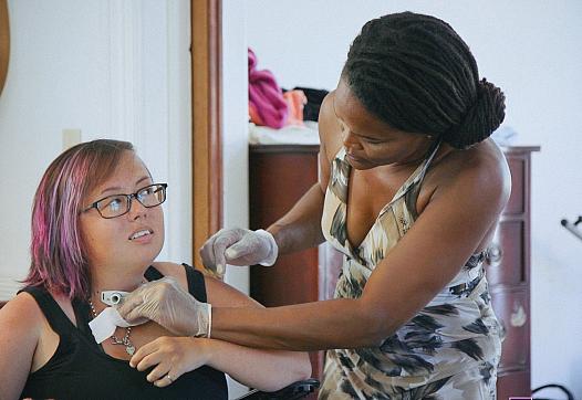 Stacey Milbern of Oakland, California relies on Medicaid-funded attendants to get out of bed, eat, bathe, and get around.