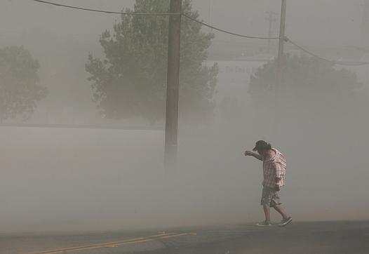 Photo credit: Craig Kohlruss/Fresno Bee: Dust storms like this one that blasted Fresno in June can carry millions of spores fromthe fungus that causes Valley Fever.