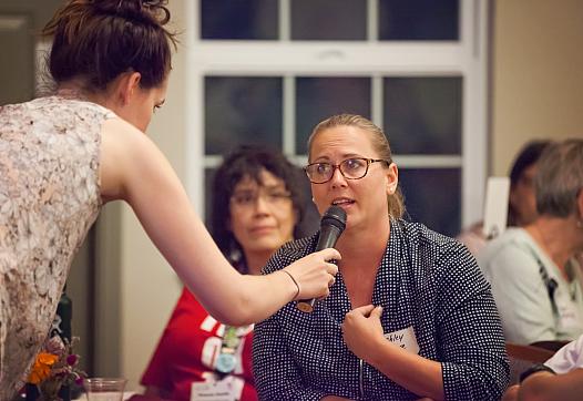 Olivia Henry holds a microphone for Amador resident Ashley Moore.