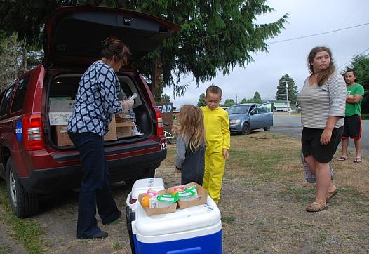 Deborah Kravitz gives breakfast to 6-year-old Mateo Rodriguez and his 4-year-old sister AnnaLee in Klamath Glen.