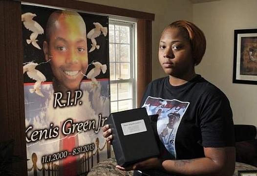 Sunsearae 'Lo Lo' Hall, mother of Kenis Green Jr., holds her son's ashes. Kenis was 12 when he was shot and killed on his front porch. Max Ortiz / The Detroit News  