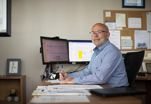 Buncombe County Health and Human Services Director Stoney Blevins sits at his desk in Asheville. 