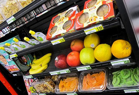 The healthy checkout aisle at the Parkersburg Foodland includes whole and sliced fruit.