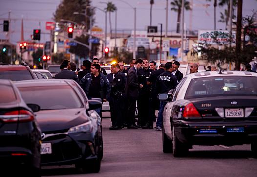 Police respond to a crime scene near Hawkins High School. (Marcus Yam / Los Angeles Times)