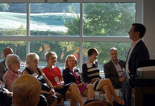 Greg Giornelli, president and CEO of Purpose Built Communities, addresses a crowd in East Lake, Atlanta. Behind him is the golf course adjacent to the Drew Charter School and East Lake Village apartments, a mixed-income neighborhood that Spartanburg leaders are hoping to use as a template as they plan and engage residents in a massive redevelopment of the Northside neighborhood.