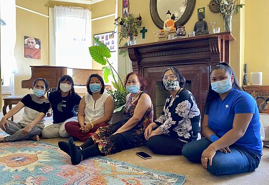 Staff members and clients on Clinic Day at the Center for Empowering Refugees and Immigrants (CERI), June 14 in Oakland, Calif.