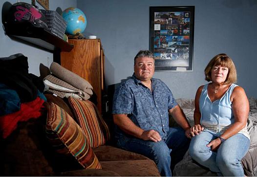 Eric and Connie Petereit pose for a portrait in their son's bedroom, at their home in Healdsburg, California on Thursday.