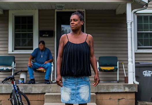 Ashley's biological mother Kim Guiden stands in front of her home in Anderson, Indiana, in 2017.