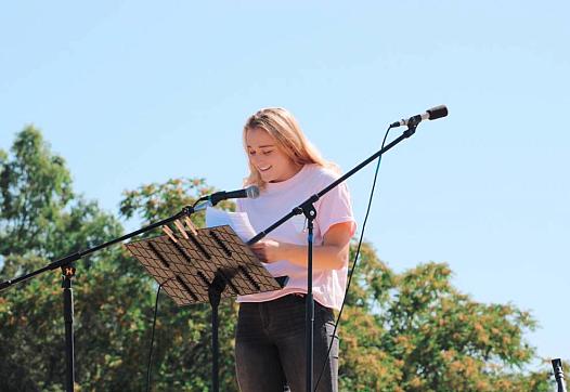 Abbi Berry, who graduated from Los Gatos High School in 2018, speaks during a rally over sexual abuse on campus.