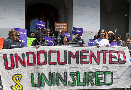 Advocates for a bill to provide healthcare to undocumented immigrants rally in at the Capitol in Sacramento. (Hector Amezcua)
