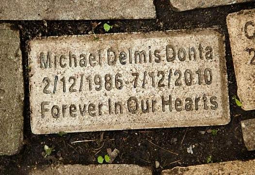 The name of Mike Donta's son, Michael Delmis Donta, is engraved on one of the bricks at the children's memorial.