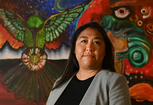 Ana Huynh, shown in her Chapel Street office, is the program director for Mixteco Indigena Community Organizing Project 
