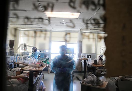 Clinicians care for Covid-19 patients in a makeshift ICU at Harbor-UCLA Medical Center on January 21, 2021 in Torrance, Californ