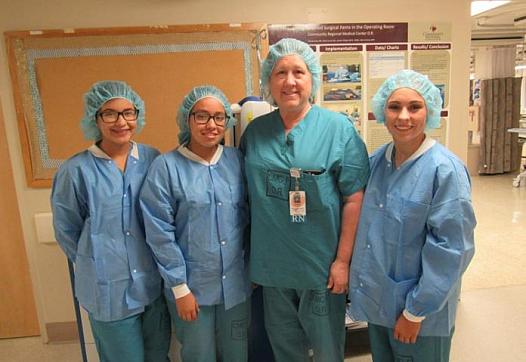 Doctors Academy students Yesenia Avina, Jennifer Becerra and Alexandra Snyder during a field visit with Debora Redondo, RN, BSN.