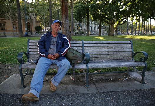 A man named Roberto sits on a bench at St. James Park in San Jose, Calif., on June 7, 2016