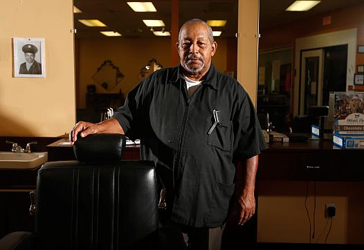 Walter Shearin talks with his customers about prostate cancer at his store, Walt's Diversity Barber Shop, in Roanoke Rapids.