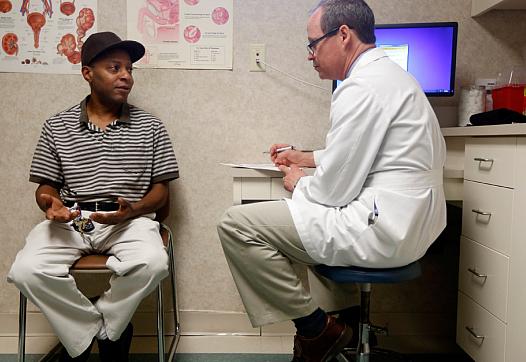 ETHAN HYMAN / ETHAN.HYMAN@NEWSOBSERVER.COM Dr. Greg Murphy talks with Jasper Barrett at Eastern Urological Associates in Greenville on Thursday, April 30, 2015. Barrett had prostate cancer.