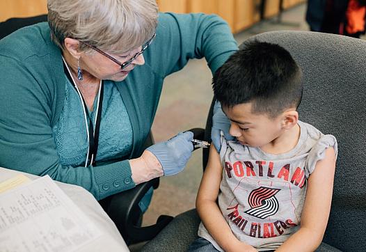 A vaccination clinic at David Douglas High School in 2019. (Henry Cromett)