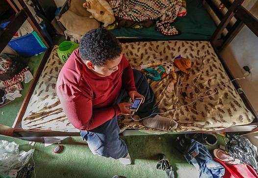 An afternoon inside the trailer of Michelle Kirkland, her husband Brandon Hughes and their two children Vivianna, 9, and Brandon