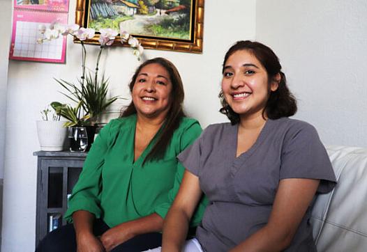 Ivonne Estela Ramos and her daughter Allison, pose for a portrait inside their studio in San Francisco's Bayview neighborhood. 