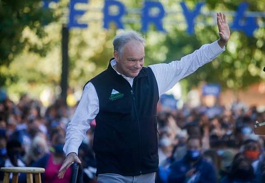 U.S. Senator Tim Kaine waives after giving remarks during a rally on Saturday, October 23, 2021 at James Branch Cabell Library i
