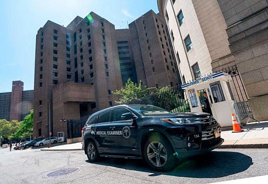 A New York Medical Examiner’s car outside the Metropolitan Correctional Center where financier Jeffrey Epstein was being held wh