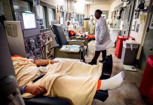 A nurse checks on inmates as they receive dialysis treatment at West Valley Detention Center in San Bernardino County. (Photo by