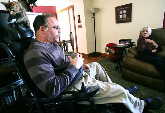 Dan Nelson and his mother, Jean, talk about his medical problems at his home in New Munster. Nelson was hospitalized after a motorcycle accident in 2000, and Dr. Lorraine Novich-Welter had trouble clearing a clog in his tracheotomy tube, depriving him of oxygen. A jury found Novich-Welter negligent, but the Wisconsin Medical Examining Board didn’t discipline her.  