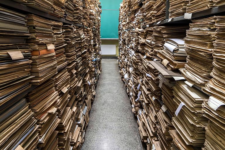 Archival files shown in a room.