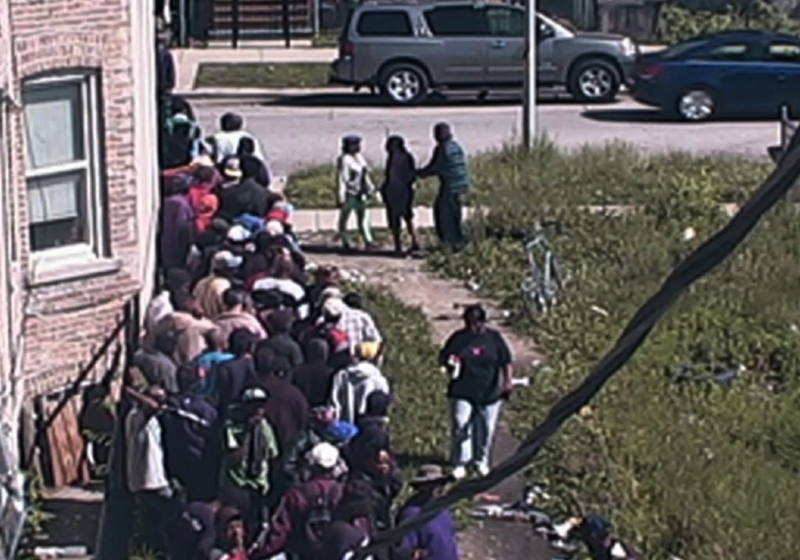 People line up to buy from a heroin market on Chicago’s West Grenshaw Street in 2015. The photo was introduced in a federal criminal complaint against an alleged drug dealer. (Credit: Photo via federal complaint)