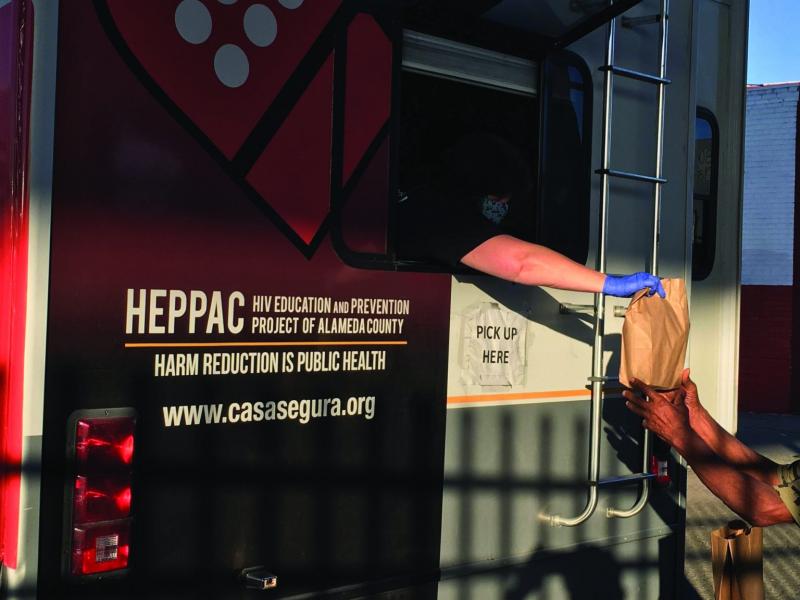 Community members collect supplies from HEPPAC in Fruitvale. (Ariel Boone)
