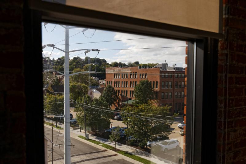 The view from the current offices of Crescent Community Health Center to its old location, a historic warehouse building once used to build caskets, shown Oct. 3, 2019 in Dubuque, Iowa. | M. Scott Mahaskey / POLITICO