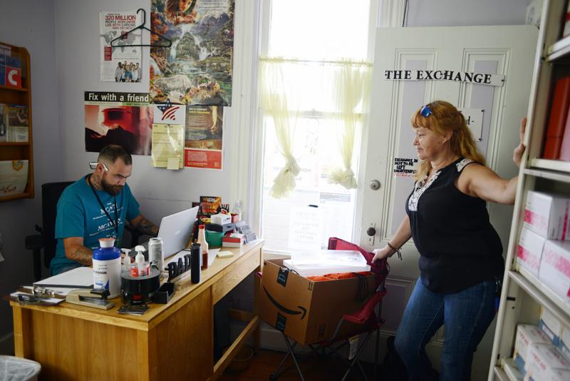 Patti Parker, an outreach and harm reduction service provider, checks in with Shawn Horn before heading out to do outreach in Ukiah on July 15, 2021. (Photo by Dana Ullman/ The Mendocino Voice)